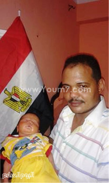 الطفل مع والده -اليوم السابع -8 -2015